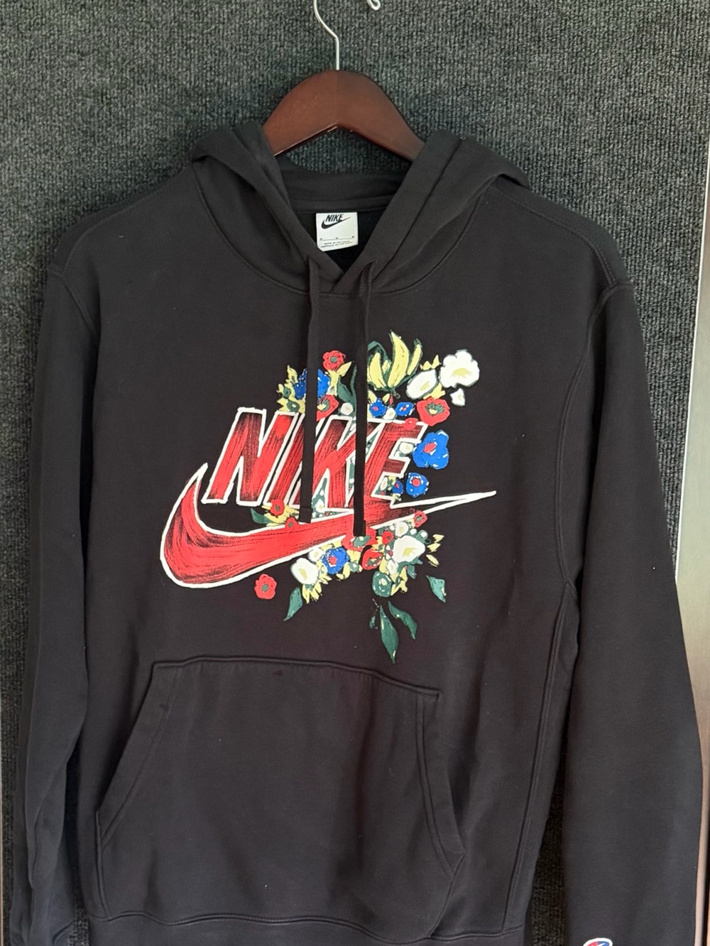 Nike Black Hoodie with Red Logo and Multicolor Floral Accent